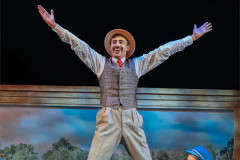 Richard David-Caine as George, arms outstretched. Photo by Helen Murray
