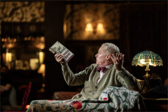 Jesse Tyler Ferguson as Truman Capote holding a copy of In Cold Blood in Tru. Photo by Johan Persson