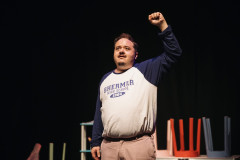 David Shopland, fist raised, in Don't You Forget About Me. Photo by Alex Brenner