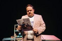 David Shopland reading a newspaper in Don't You Forget About Me. Photo by Alex Brenner