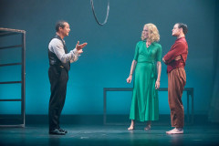 Three performers beneath an aerial hoop in The Law of Mayhem