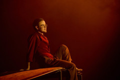 A performer in a red shirt in The Law of Mayhem