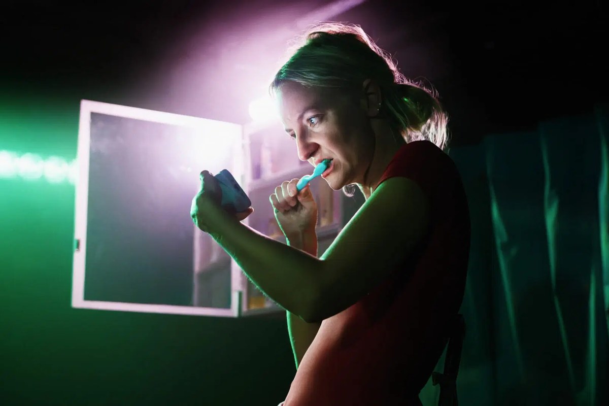 Julia Grogan at the mirror in You’re So Special at Soho Theatre