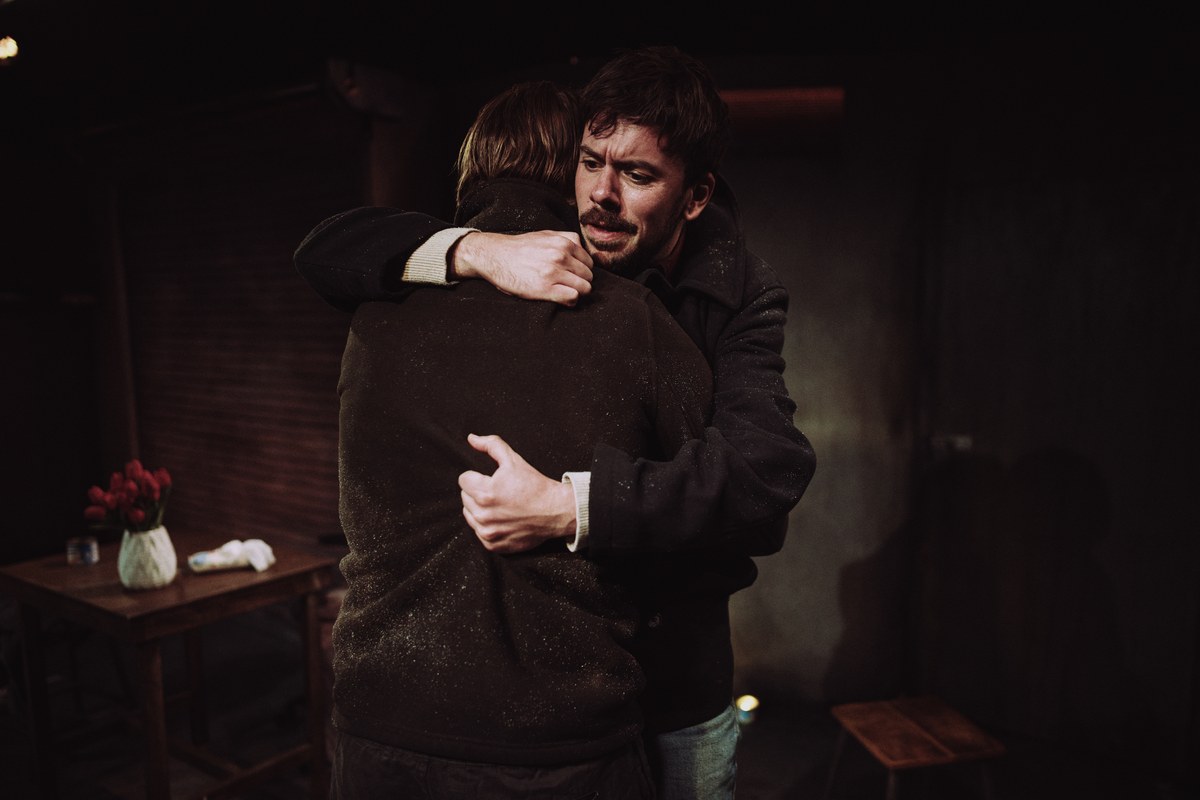 Ashton and Reece embrace in A Slow Fire at Jermyn Street Theatre