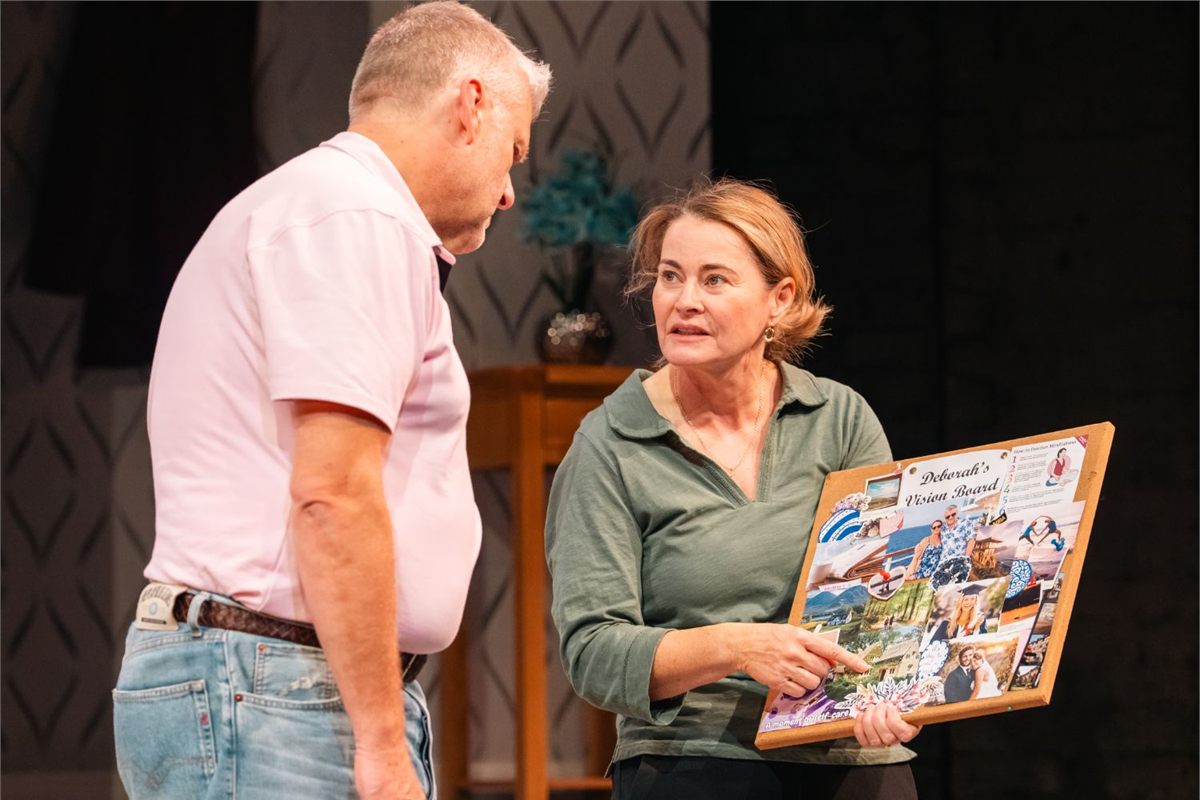 Sarah Belcher shows a vision board to Phil Corbitt in All at Sea at Live Theatre, Newcastle. Photo by Von Fox Promotions