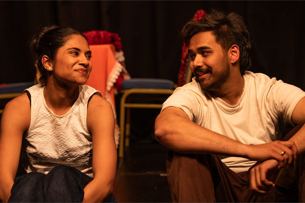 The couple at the heart of Are You Even Indian?, seated on stage. Photo by Deven Ahire