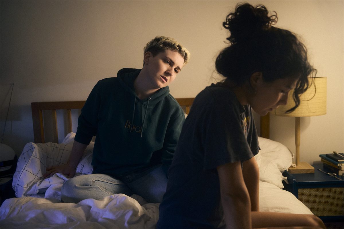 A couple on a bed in an image for ATTENTION at the Bush Theatre