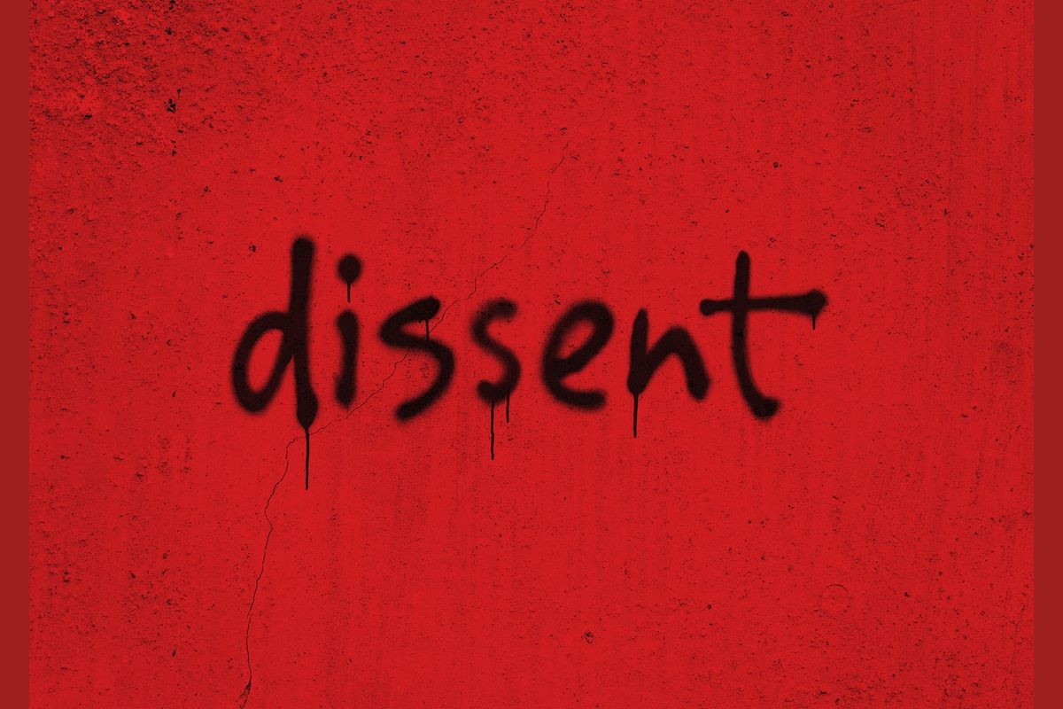 Artwork for dissent by debbie tucker green, the title sprayed in black on a red wall, at the Young Vic