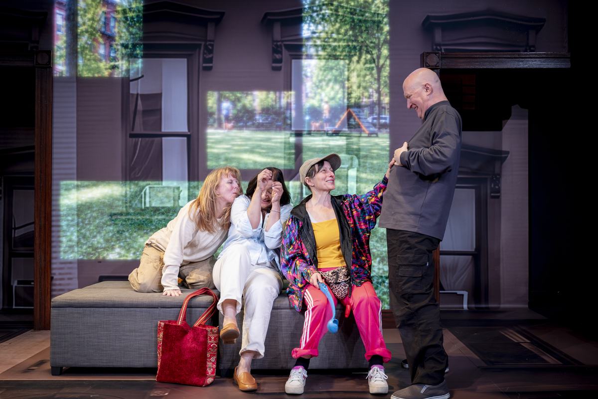 The cast on the sofa in front of a projected park in Dog Mom at Southwark Playhouse Borough