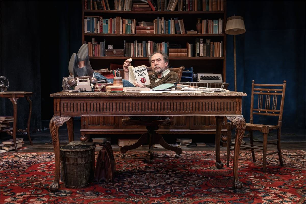 Dominic Mafham as Frank at his desk in Educating Rita at Curve, Leicester. Photo by Jonathan Pryke