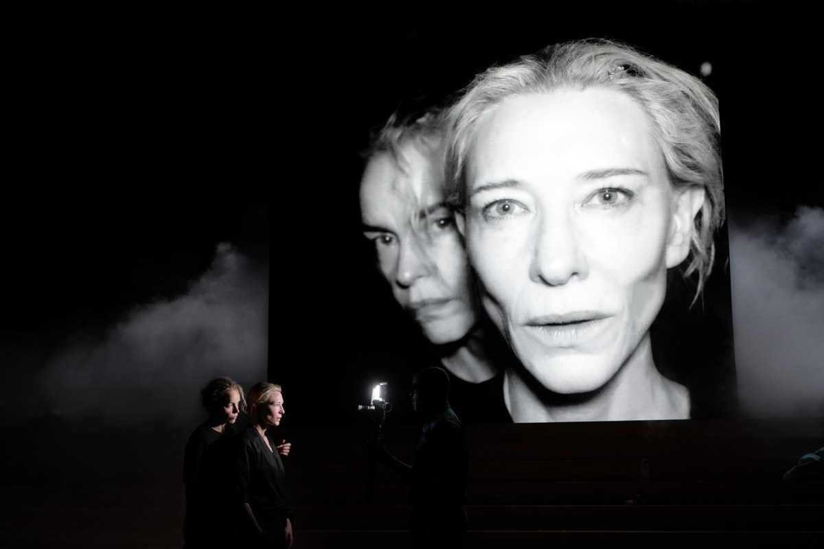 Cate Blanchett and Nina Hoss projected on screen in Electra/Persona at the National Theatre