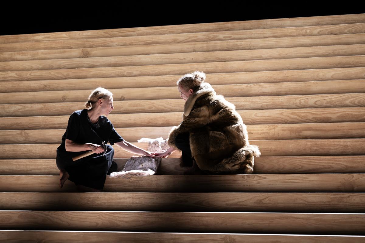 Two performers on the staircase set of Electra/Persona at the National Theatre