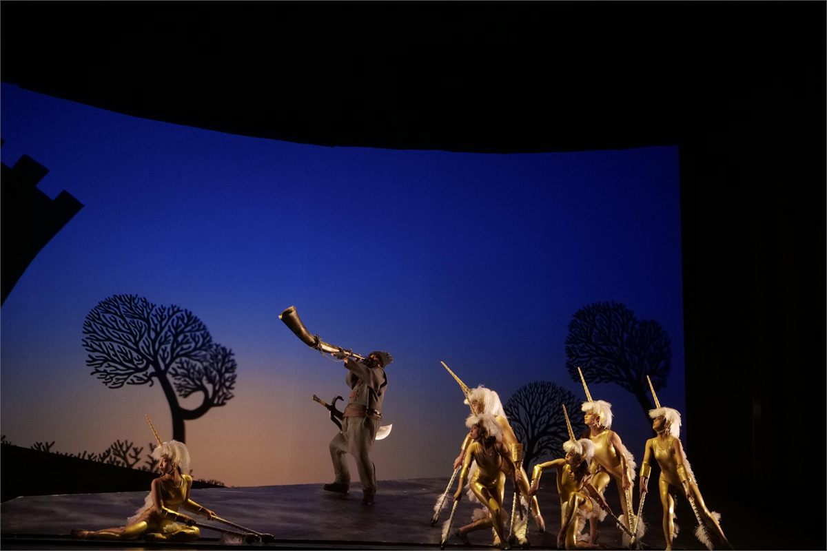 Shinya Matsuda as the Gatekeeper with dancers as unicorns in End of the World and Hard-Boiled Wonderland at the Barbican Theatre