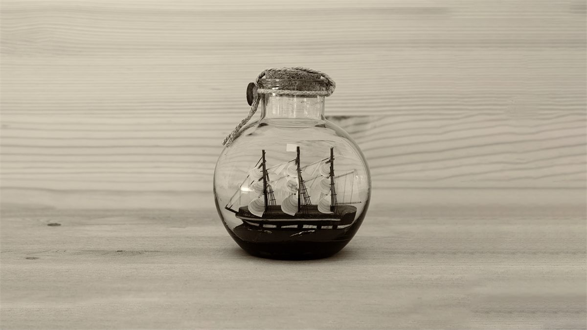 Key art for Dogstar at Hampstead Theatre: a sailing ship in a bottle