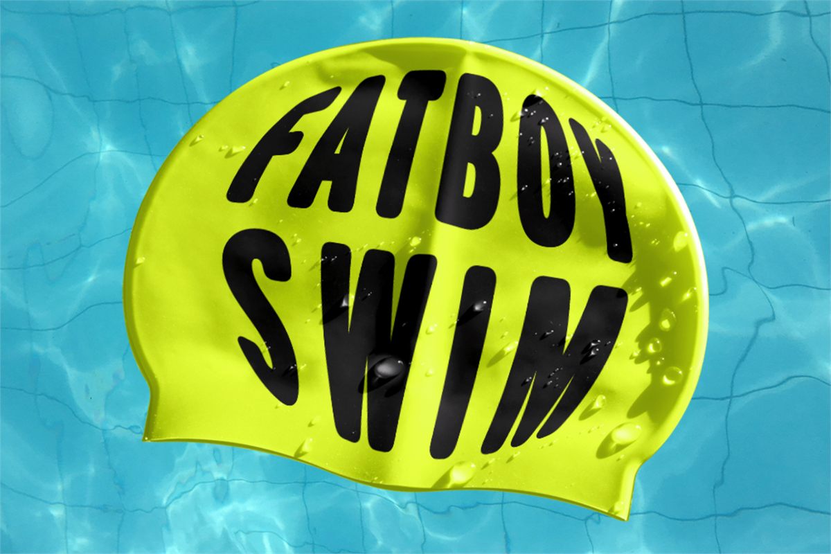 Fat Boy Swim artwork: a yellow swimming cap printed with the title, floating in a swimming pool