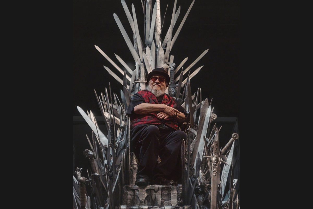 George R. R. Martin on the Iron Throne at the Royal Shakespeare Theatre, announcing the London transfer of Game of Thrones: The Mad King