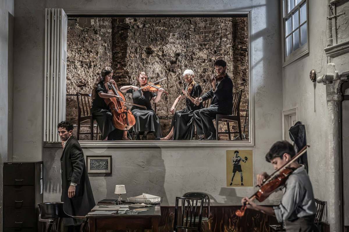 The string quartet revealed behind the set in Golden Boy at the Almeida Theatre. Photo by Marc Brenner