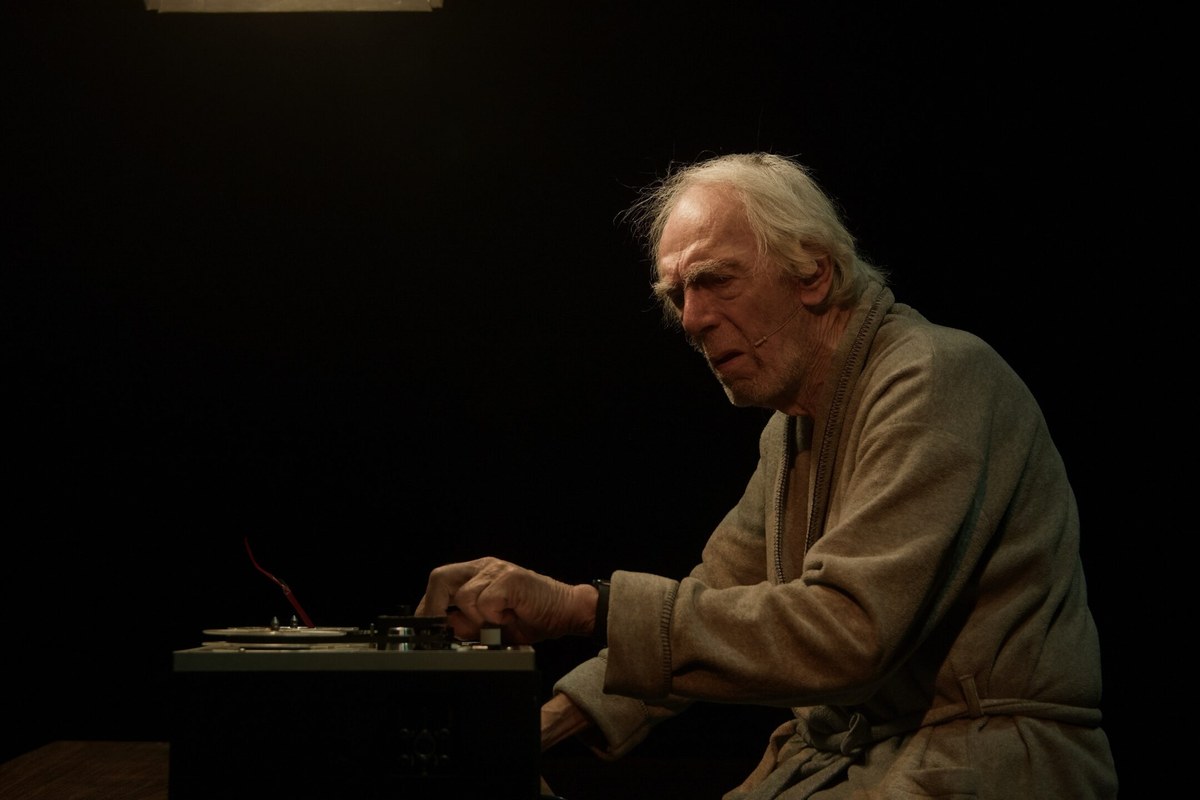 Peter Marinker leaning over the tape recorder in profile in Krapp’s Last Tape at The Cockpit