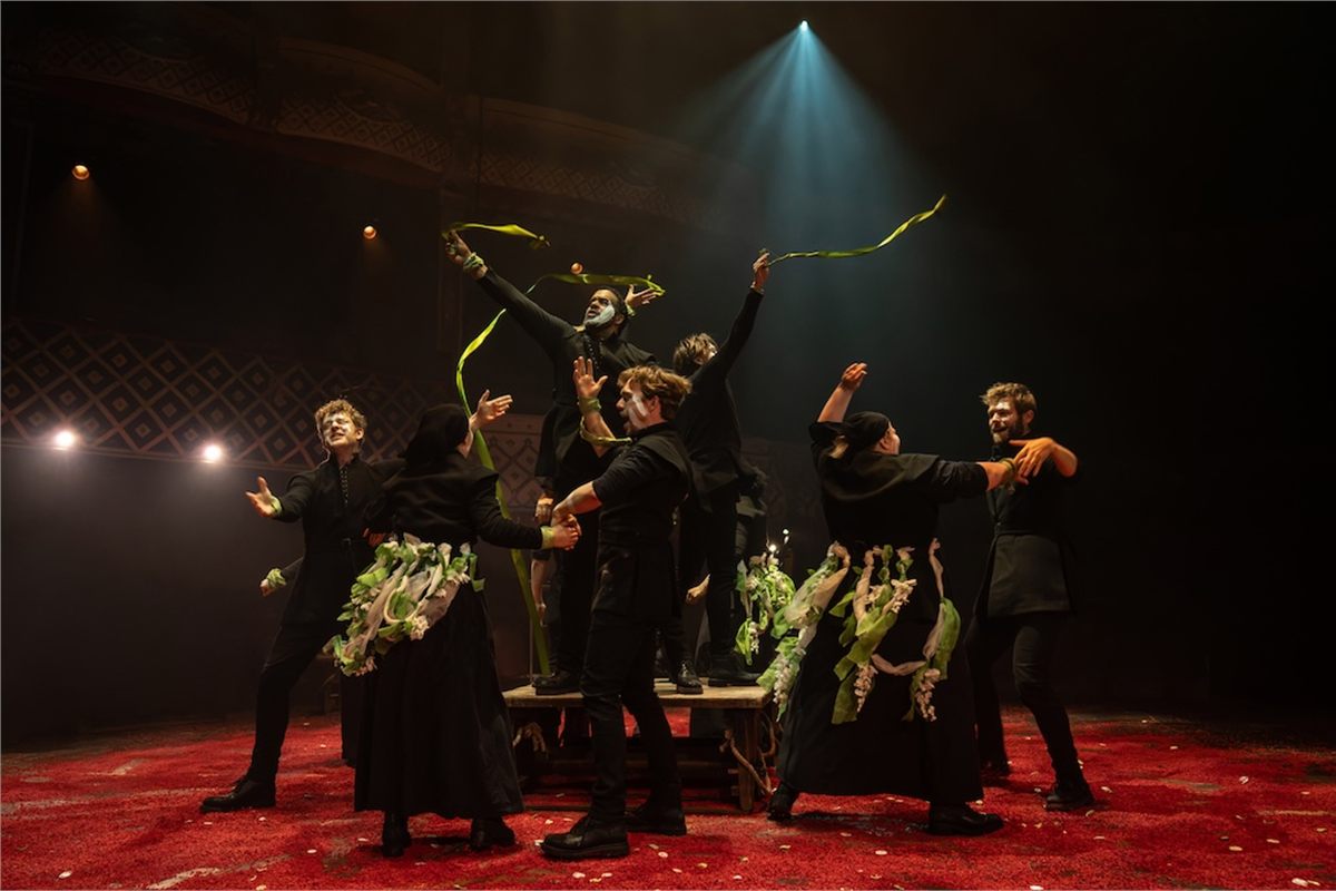 The company of Martin Guerre waving ribbons in a village celebration at the Old Vic. Photo by Helen Maybanks