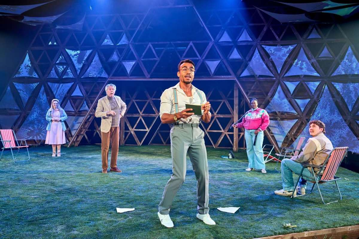 Munya Chawawa as Bottom with members of the company in A Midsummer Night's Dream at Chichester Festival Theatre. Photo by Manuel Harlan