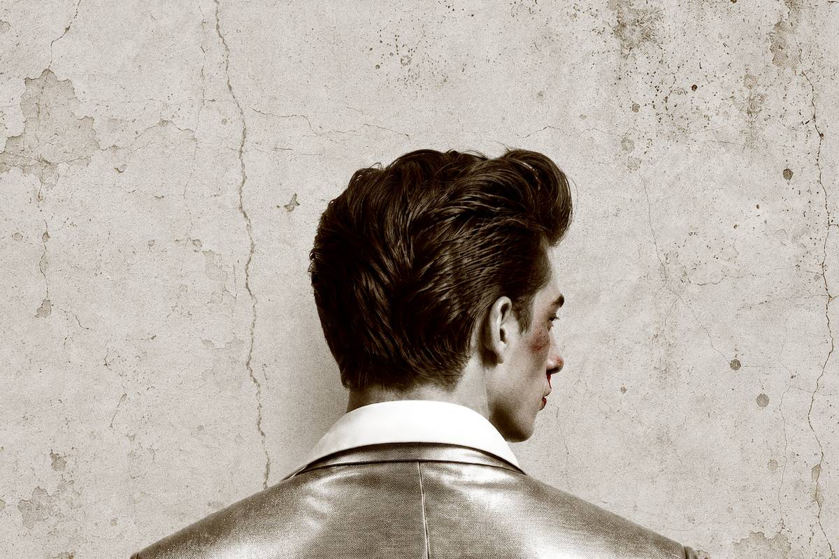 Artwork for Mojo at Park Theatre: a young man with a quiff and a metallic jacket, seen from behind against a cracked wall