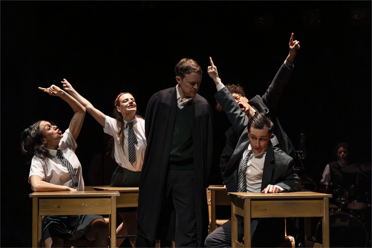 A classroom scene in The Nature of Forgetting by Theatre Re. Photo by Ellie Kurttz
